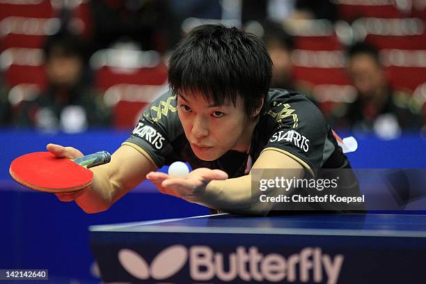 Kenji Matsudaira of Japan serves during his match against Yang Zi of Singapore during the LIEBHERR table tennis team world cup 2012 championship...