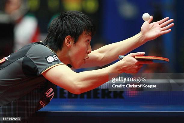 Kenji Matsudaira of Japan serves during his match against Yang Zi of Singapore during the LIEBHERR table tennis team world cup 2012 championship...