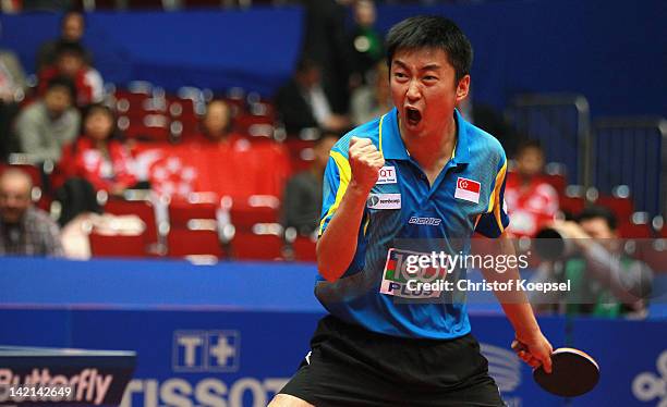 Yang Zi of Singapore celebrates his victory against against Kenji Matsudaira of Japan during the LIEBHERR table tennis team world cup 2012...