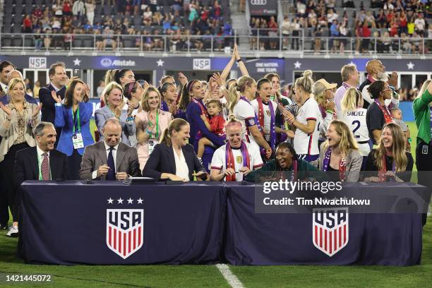 Members of U.S. Soccer and the U.S. Women's National Team Players Association sign a collective bargaining agreement signifying equal pay between the...