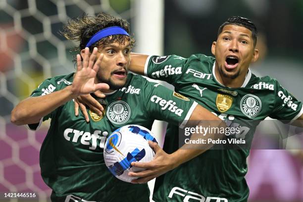 Gustavo Scarpa of Palmeiras celebrates with teammate Roni after scoring the opening goal during a Copa CONMEBOL Libertadores 2022 second-leg...