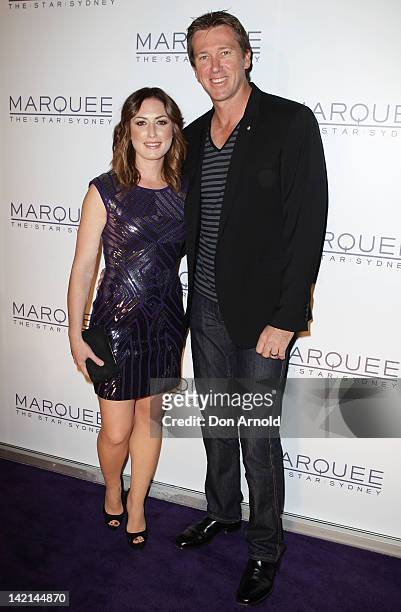 Sara Leonardi and Glenn McGrath pose on the red carpet during the opening of Marquee Nightclub at The Star on March 30, 2012 in Sydney, Australia.