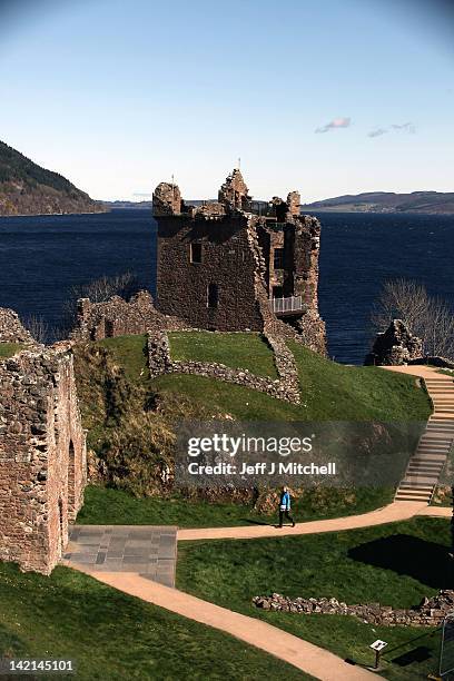 Tourists visit Urquhart Castle on Loch Ness on March 30, 2012 in Drumnadrochit, United Kingdom.