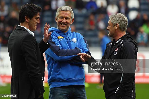 Manager Jens Todt of Bochum chats with head coaches Andreas Bergmann of Bochum and Armin Veh of Frankfurt prior to the Second Bundesliga match...