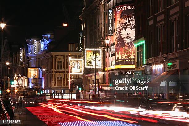 Cars travel along Shaftesbury Avenue past West End theatres at night on March 29, 2012 in London, England.