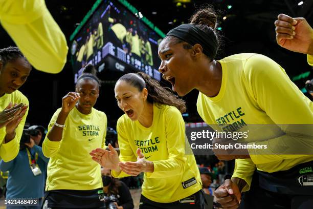 Sue Bird and Jantel Lavender of the Seattle Storm huddle with their teammates before the game against the Las Vegas Aces in Game Four of the 2022...