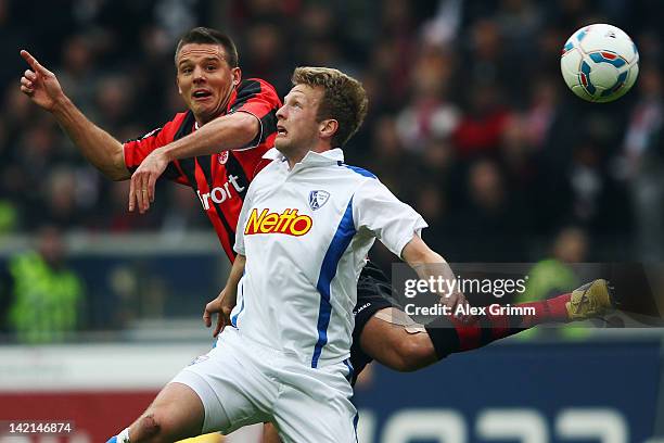 Alexander Meier of Frankfurt jumps for a header with Bjoern Kopplin of Bochum during the Second Bundesliga match between Eintracht Frankfurt and VfL...