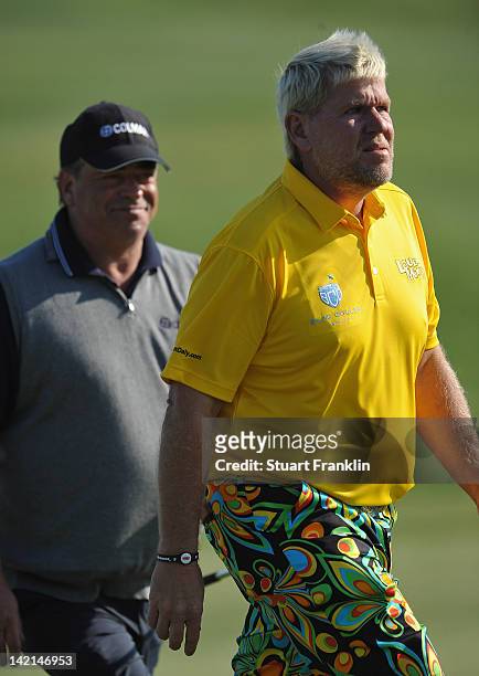 John Daly of USA walks with Costantino Rocca of Italy whom he beat the win The Open championship at St. Andrews in 1995, during the second round of...