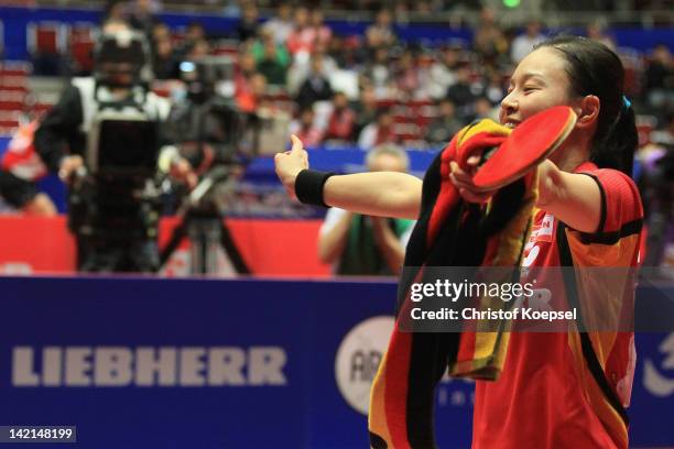 Wu Jiaduo of Germany celebrates her victory after winning against Wang Yuegu of Singapore during the LIEBHERR table tennis team world cup 2012...