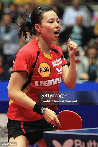 Wu Jiaduo of Germany celebrates her victory after winning against Wang Yuegu of Singapore during the LIEBHERR table tennis team world cup 2012...