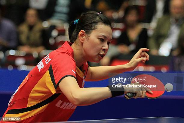 Wu Jiaduo of Germany plays a backhand during her match against Wang Yuegu of Singapore during the LIEBHERR table tennis team world cup 2012...