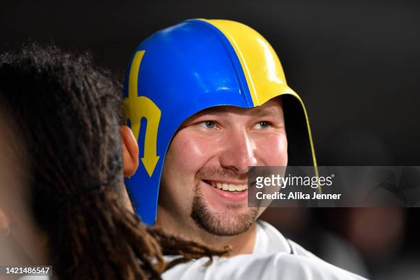 Cal Raleigh of the Seattle Mariners celebrates with teammates after hitting a two-run home run during the eighth inning against the Chicago White Sox...