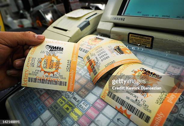 Mega Millions lottery tickets sit on a registar at Liquorland on March 30, 2012 in Covina, California The Mega Millions jackpot has reached a high of...