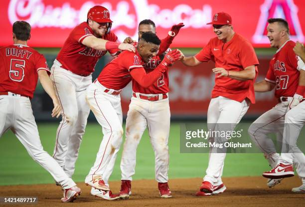 Magneuris Sierra of the Los Angeles Angels celebrates his bunt to bring Andrew Velazquez home for a walk off win against the Detroit Tigers at Angel...
