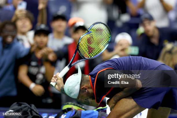 Nick Kyrgios of Australia smashes his racket after being defeated by Karen Khachanov in their Men’s Singles Quarterfinal match on Day Nine of the...
