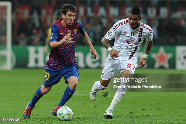 Lionel Messi of FC Barcelona in action against Kevin-Prince Boateng of AC Milan during the UEFA Champions League quarter final first leg match...