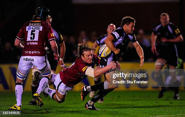 Newcastle Falcons flyhalf Jimmy Gopperth is tackled just short of the line by Andy Powell of Sale during the Aviva Premiership match between...