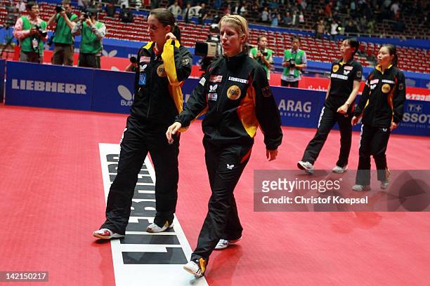 Sabine Winter, Kristin Silbereisen, national coach Jie Schoepp and Wu Jiaduo of Germany look dejected after Irene Ivancan of Germany has lost the...