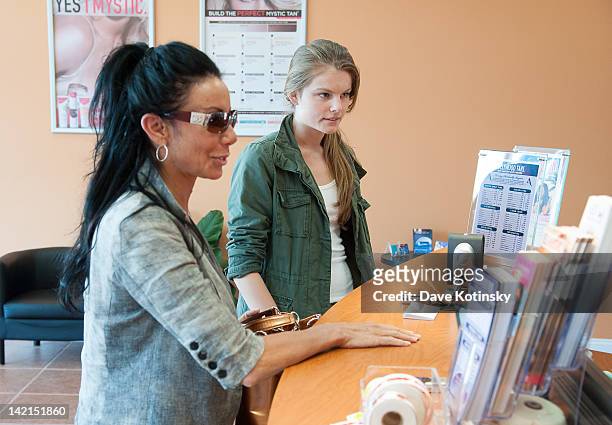 Danielle Staub and daughter Christine Staub visit Hollywood Tans at Edgewater Commons on March 30, 2012 in Edgewater, New Jersey.