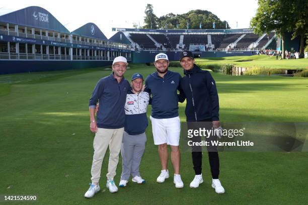 Tom Felton, Brendan Lawlor, Tyrrell Hatton of England and Lando Norris pose for a photograph on the 18th green during the BMW PGA Championship Pro-Am...