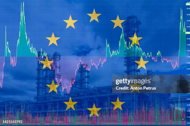 energy crisis in europe. liquid natural gas plant on the background of the eu flag - gas plant sunset stock-fotos und bilder