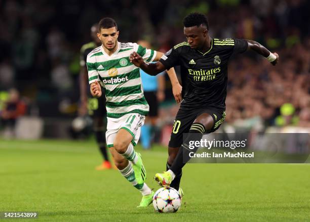 Vinicius Junior of Real Madrid evades Liel Abada of Celtic during the UEFA Champions League group F match between Celtic FC and Real Madrid at Celtic...
