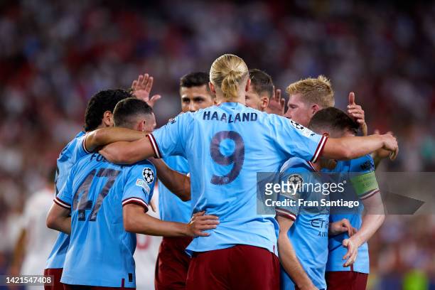 Erling Haaland of Manchester City celebrates scoring their teams third goal during the UEFA Champions League group G match between Sevilla FC and...