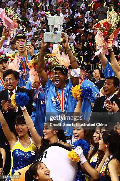 Stephon Marbury of the Beijing Ducks holds up the trophy after winning Game 5 the 2012 CBA Championship Finals against the Guangdong Southern Tigers...