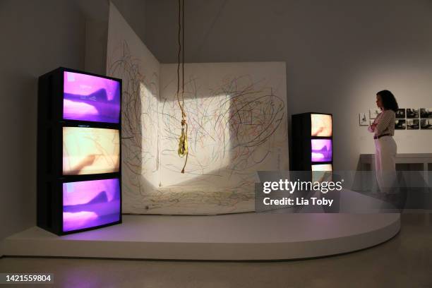 Person observes the Carolee Schneemann's "Body Politics" Installation at Barbican Art Gallery on September 06, 2022 in London, England.