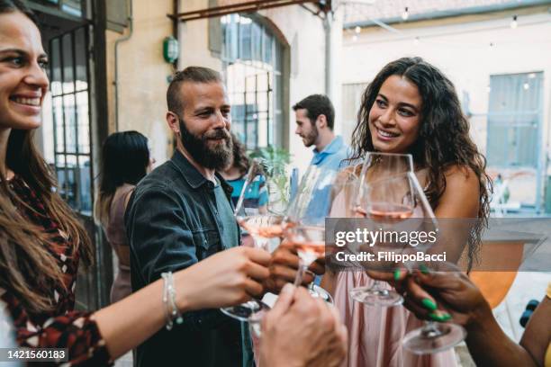 friends are celebrating together with wine glasses - generation x stock pictures, royalty-free photos & images