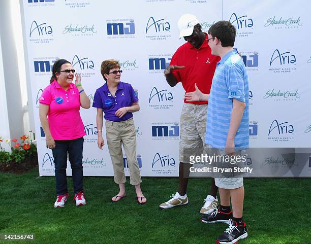 Sister Natalie Stroud, Mother Tammy Stroud and Make-A-Wish child Lucas Stroud attend the 11th Annual Michael Jordan Celebrity Invitational hosted by...