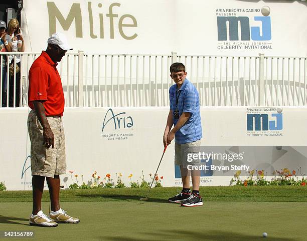 Michael Jordan fulfills a wish for Make-A-Wish child Lucas Stroud at the 11th Annual Michael Jordan Celebrity Invitational hosted by Aria Resort &...