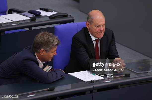 German Chancellor Olaf Scholz and Economy and Climate Action Minister Robert Habeck attend debates at the Bundestag over the next federal budget and...