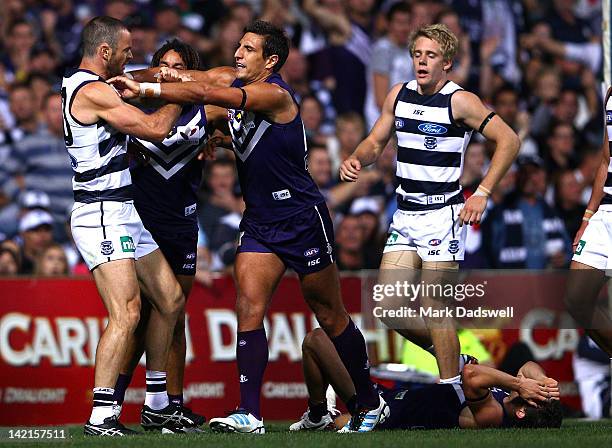 Matthew Pavlich of the Dockers remonstrates with Matthew Scarlett of the Cats during the round one AFL match between the Fremantle Dockers and the...