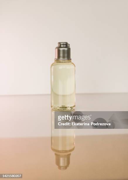 cosmetic bottle, cosmetics, skin and body care, skin oil, relaxation, can of products - jojoba oil stock pictures, royalty-free photos & images