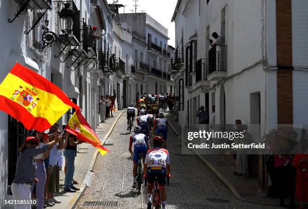 General view of the peloton passing through Aracena start village while fans cheer during the 77th Tour of Spain 2022, Stage 17 a 162,4km stage from...