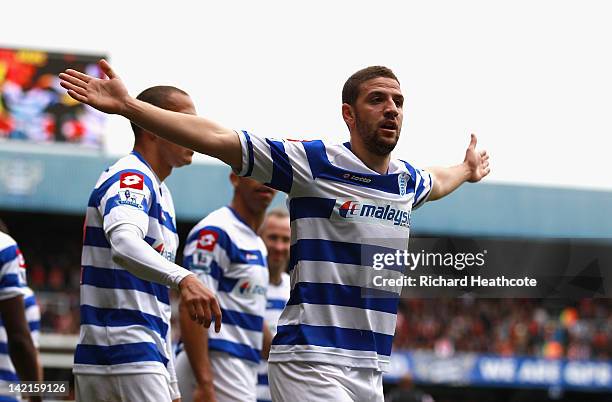 Adel Taarabt of Queens Park Rangers celebrates scoring the opening goal during the Barclays Premier League match between Queens Park Rangers and...