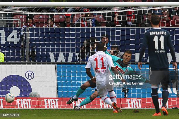 Nando Rafael of Augsburg scores his team's second goal with a penalty against goalkeeper Michael Rensing of Koeln during the Bundesliga match between...