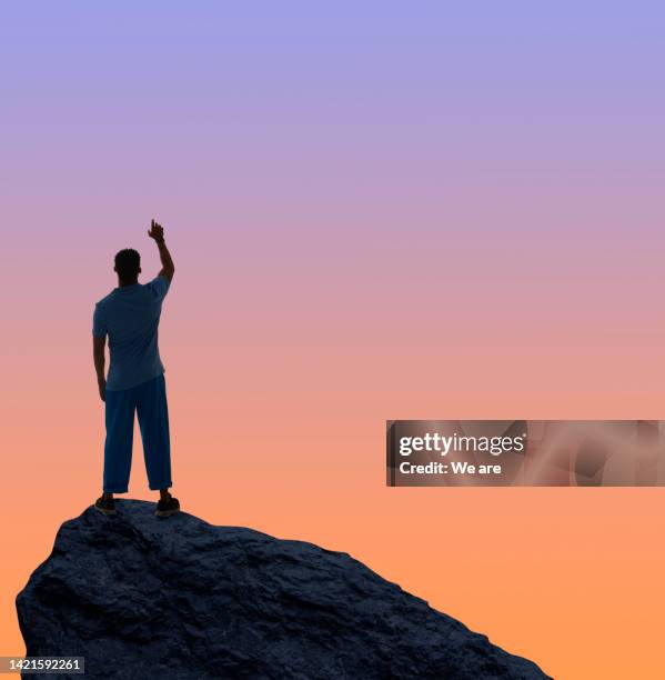 man reaching into the unknown - arms raised foto e immagini stock