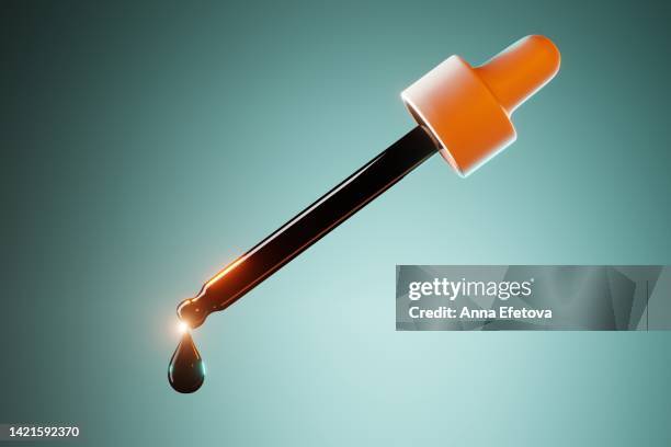 glass pipette with drop of cbd oil. front view - vitamin drip stock pictures, royalty-free photos & images