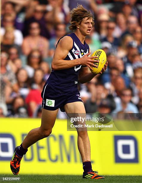 Nathan Fyfe of the Dockers gathers the ball during the round one AFL match between the Fremantle Dockers and the Geelong Cats at Patersons Stadium on...