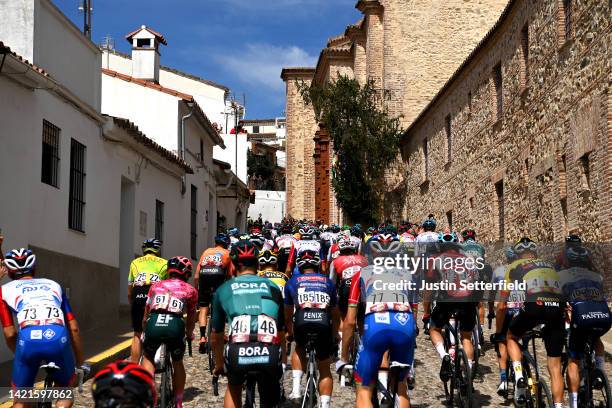 General view of the peloton passing through Aracena start village while fans cheer during the 77th Tour of Spain 2022, Stage 17 a 162,4km stage from...