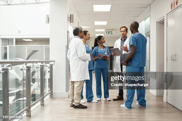 teamwork, innovation and medical breakthrough with doctors discussing cancer diagnosis and solution planning. healthcare workers collaborating on disease control, discussing surgery and treatment - ipad white background stock pictures, royalty-free photos & images