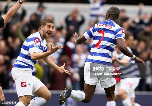 Samba Diakite of Queens Park Rangers celebrates scoring his side's second goal with team mate Adel Taarabt during the Barclays Premier League match...