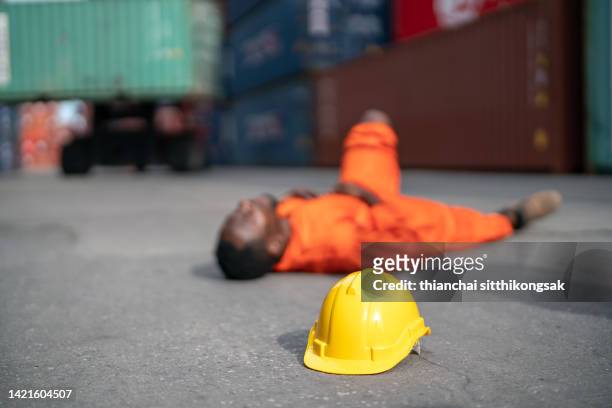 containers worker accident in shipping container port. - building site accidents stock pictures, royalty-free photos & images