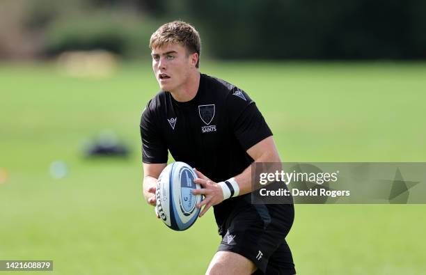 Tommy Freeman runs with the ball during the Northampton Saints training session held at Franklin's Gardens on September 07, 2022 in Northampton,...