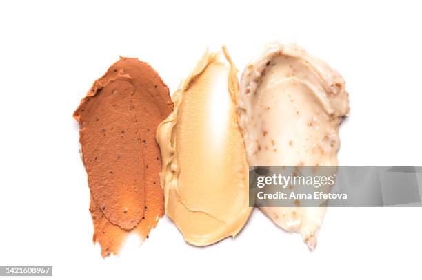 three swatch of ice cream arranged on white background. caramel ice cream, creme brulee and with white chocolate. degustation of different tastes. flat lay style - chocolat texture stockfoto's en -beelden