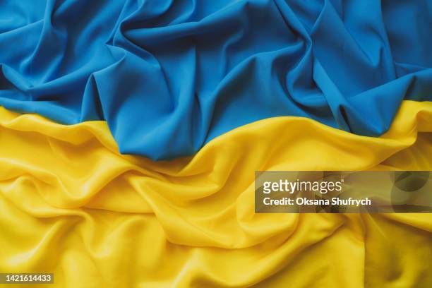 crumpled ukraine flag - top view - ukraine war imagens e fotografias de stock