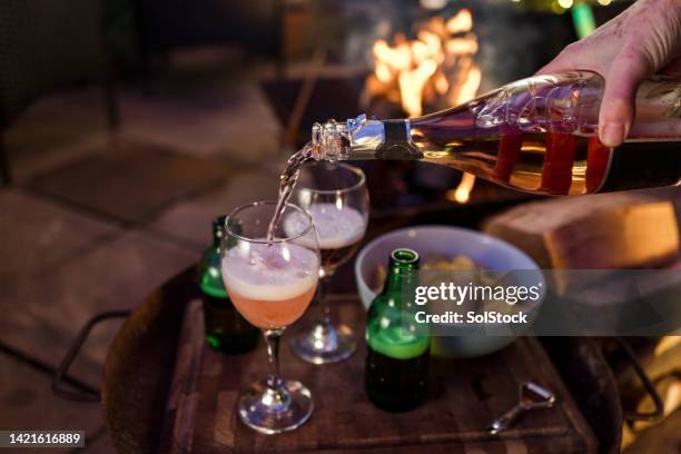 pouring the prosecco - sparkling wine stock pictures, royalty-free photos & images