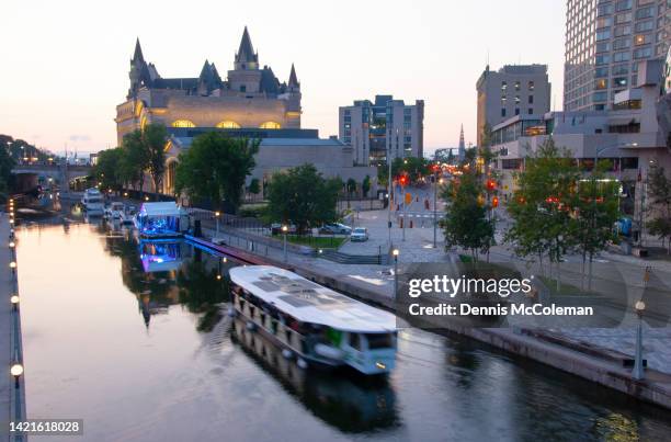 rideau canal with tour boat, night, ottawa, ontario, canada - ottawa night stock pictures, royalty-free photos & images